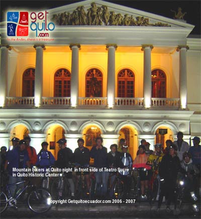 Mountain bikers at Teatro Sucre in a night trip aroun Quito HIstoric Center